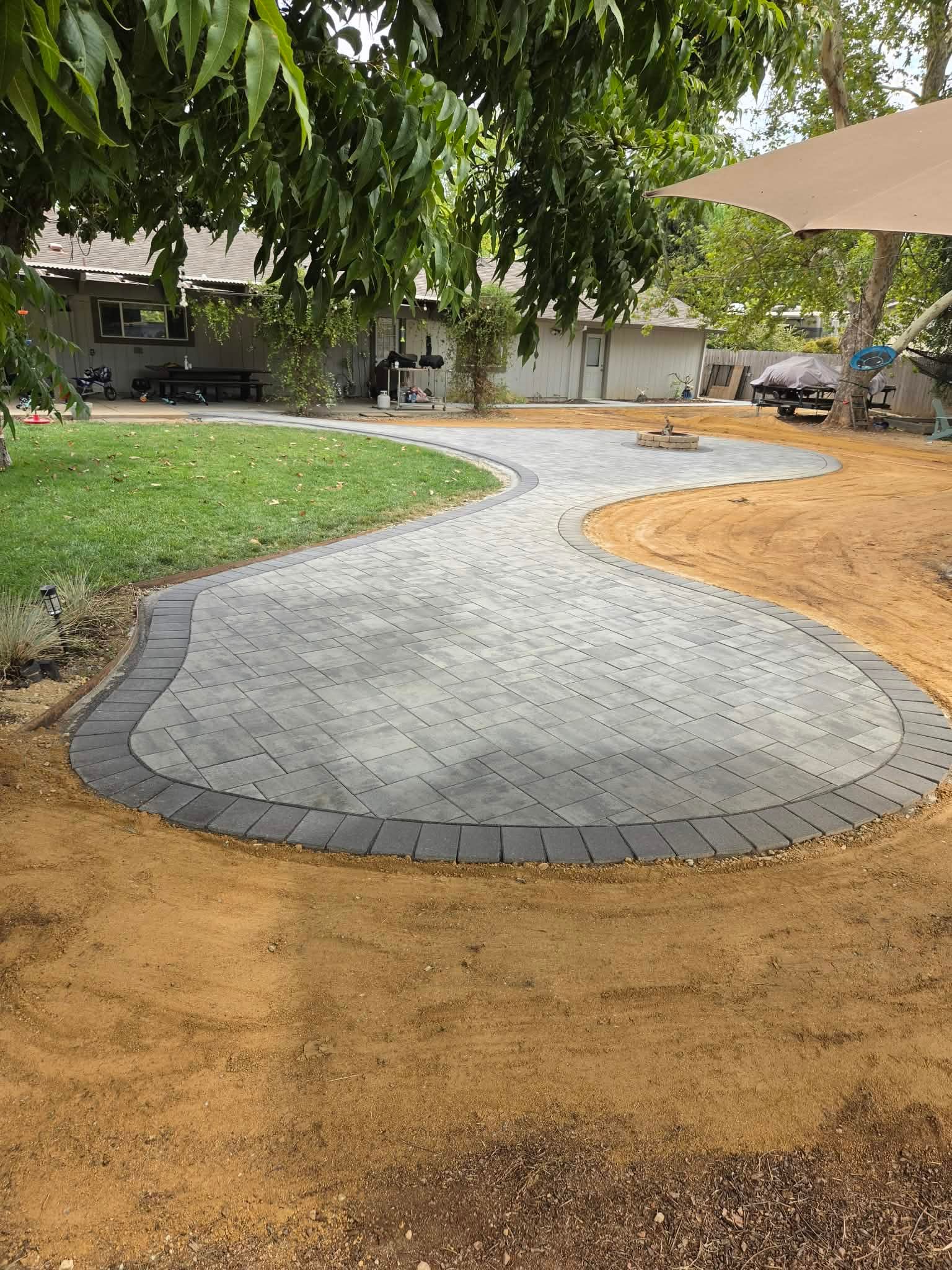 Curved Premier Smooth paver patio and walkway in Torino color