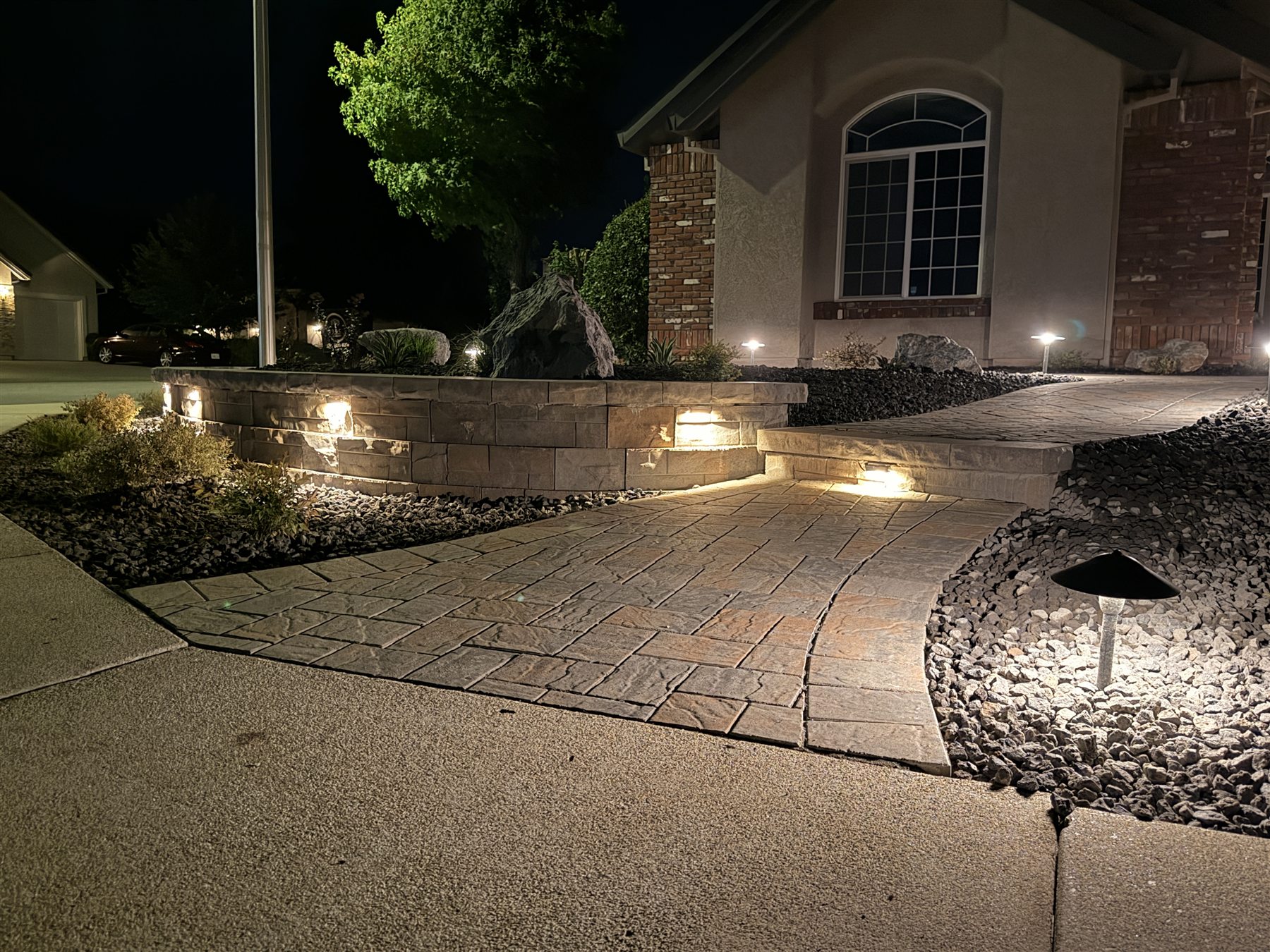 Retaining wall and front walkway with low-voltage landscape lighting