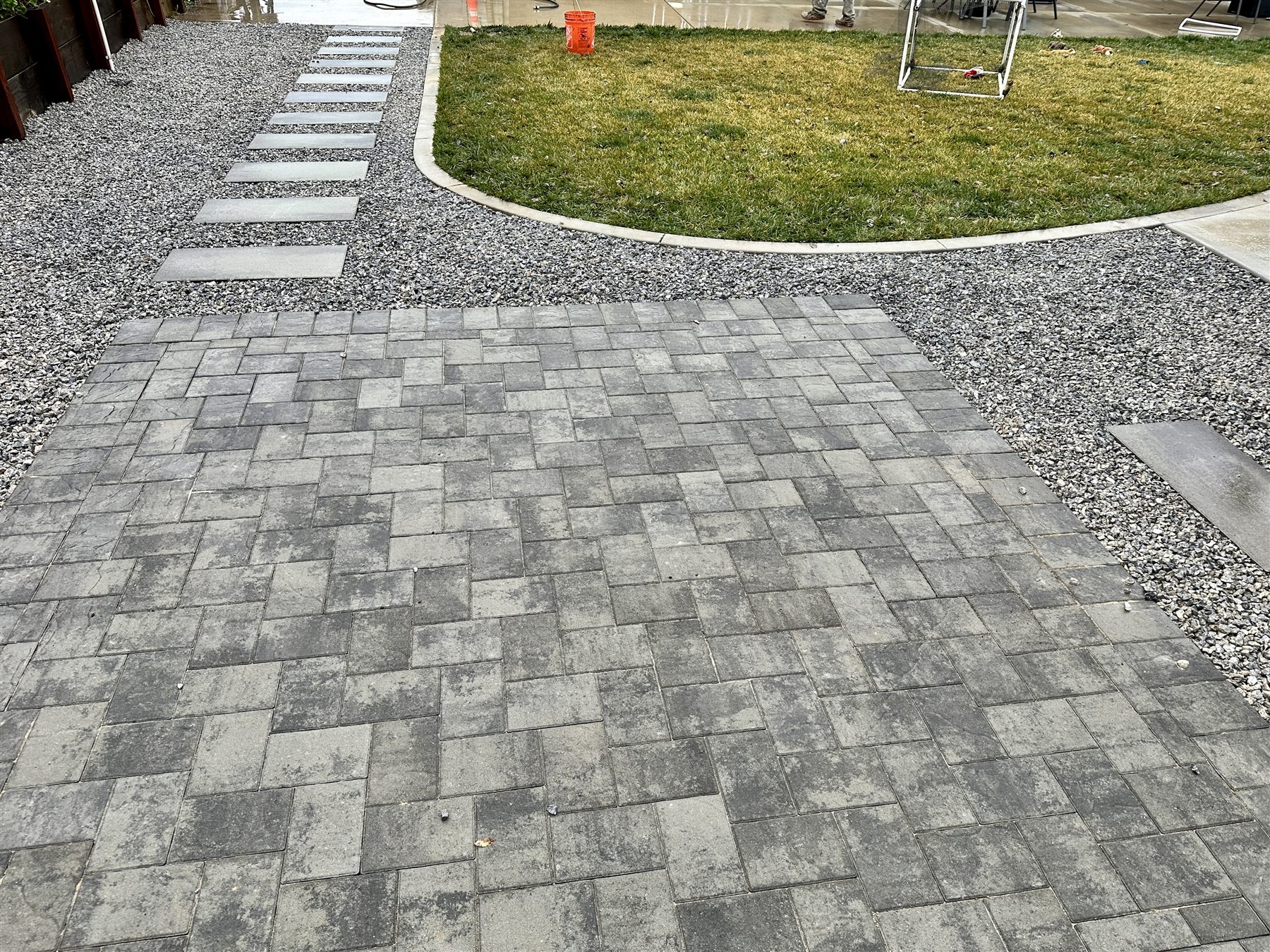 Paver patio with step pavers leading through the landscape