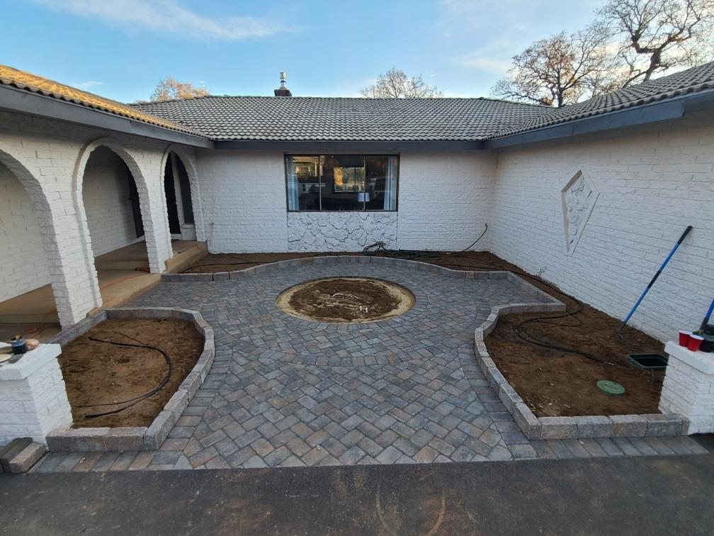 Front courtyard finished with pavers and planting beds